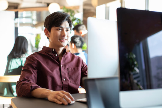Young college student using computer