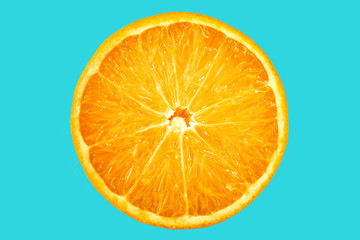 Orange fruit vegan on blue background. Vitamin-C in natural form of fruit cut in half delicious.