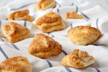Home-baked cottage cheese biscuits on cloth, side view. Close-up.