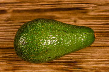 Ripe avocado fruit on a wooden table