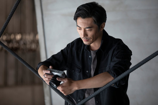 Photographer using camera in studio