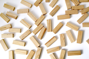 Wooden rectangles arranged differently over a white background. Copy space. Cover background...