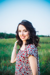 Close up Portrait of caucasian young woman or girl on green meadow enjoying nature summer. Calm and harmony. Nature rest. Summer vacation,fun, positive mood,romantic. Vertical card. Copy space.