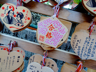 Wooden votive plaque (Ema's) hanging at Tsuyunoten Shrine