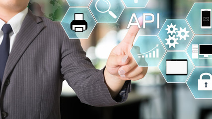 API Application Programming Interface businessman pointing a visual icon.