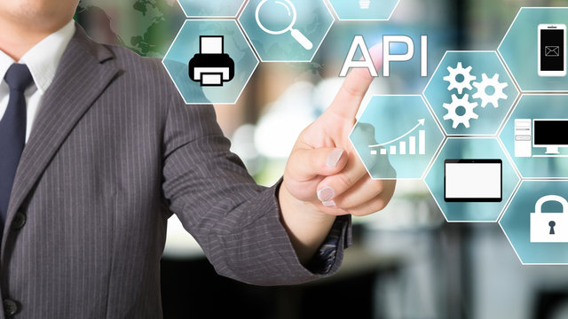 API Application Programming Interface businessman pointing a visual icon.
