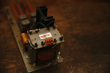 Fototapeta premium Electrician's workplace with soldering iron and printed circuit Board