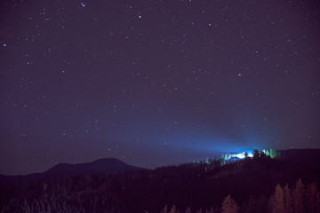 Naklejka premium Beautiful landscape. Night sky with stars in the Carpathian mountains.