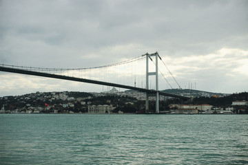 Fototapeta na wymiar Bosphorus Strait. View of the bridge and the Bosphorus Strait from the ferry. Turkey, Istanbul.