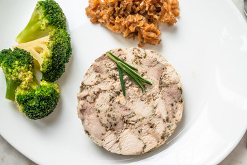 Homemade chicken ham with braised cabbage and broccoli