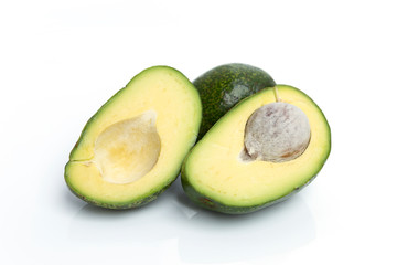 Young avocado isolate on white background, slice of fresh avocado, diet food concept