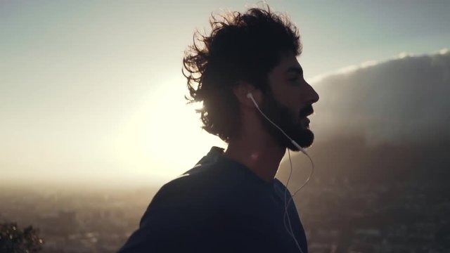 Male athlete running at sunrise