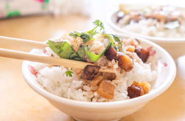 Braised pork over rice - Taiwan famous traditional street food delicacy. Soy-stewed pork on rice....