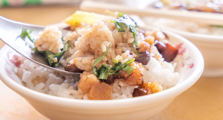 Braised pork over rice - Taiwan famous traditional street food delicacy. Soy-stewed pork on rice. Travel design concept. Top view,copy space,close up