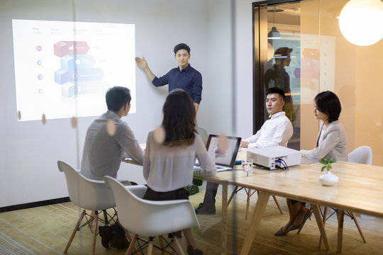 Business people having meeting in board room 