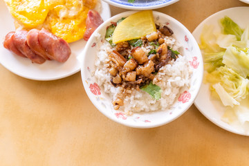 Braised pork over rice - Taiwan famous traditional street food delicacy. Soy-stewed pork on rice. Travel design concept. Top view,copy space,close up
