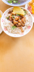Braised pork over rice - Taiwan famous traditional street food delicacy. Soy-stewed pork on rice. Travel design concept. Top view,copy space,close up