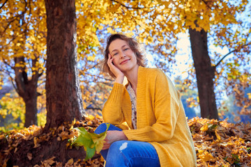 Lovely woman in autumn park