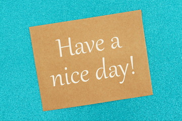 Have a nice day message on a brown greeting card