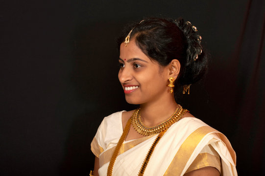 Young Girl In Traditional Kerala Saree And Jewelry.