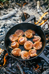 Grilled lamb meat on a campfire