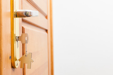 A key in a lock with house icon on it