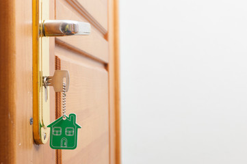 A key in a lock with house icon on it
