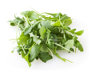 Heap of fresh arugula leaves isolated on white background