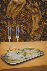 candle in candlestick on wooden table