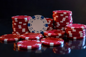 Colorful casino chips on table close up