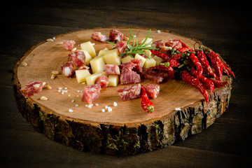 top view diced salami and cheese bowl on a wooden