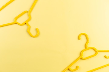 Yellow hangers on yellow background