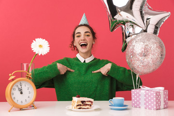 Cheerful young nerd student girl celebrating her birthday