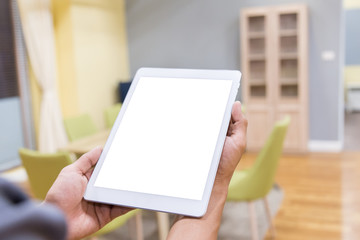 Mockup tablet on businessman hands empty display on home table with blur background. - Image - Image