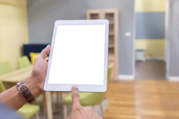 Mockup tablet on businessman hands empty display on home table with blur background. - Image - Image