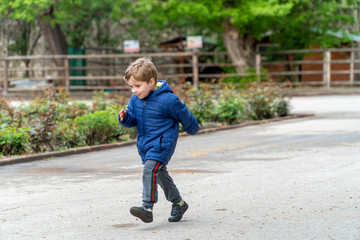 Small child running in a park