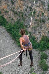Mimi Guesdon hanging in heels on a highline above the Red Lake, Split-Dalmatia, Imotski, Croatia