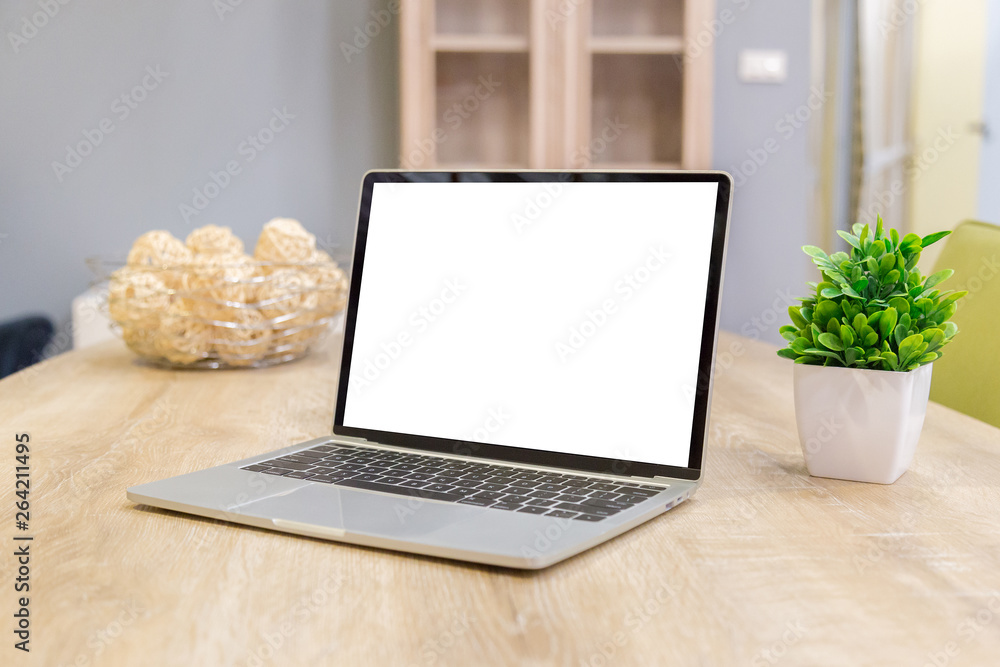 Wall mural laptop showing blank screen on work table front view in home- image