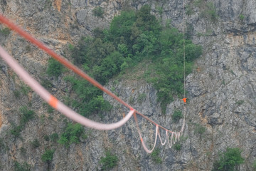 a man walking on a highline above the Red Lake, Split-Dalmatia, Imotski, Croatia