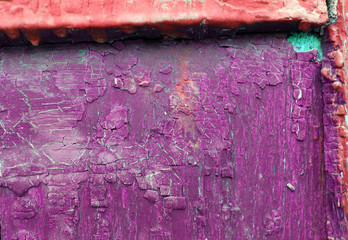 Old wooden background with remains of pieces of scraps of old paint on wood. Texture of an old tree, vintage wood background peeling paint. old blue board with cracked paint