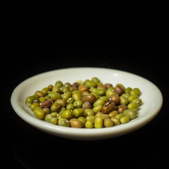 mung beans, mash. green beans in a white plate on the table. top food background. copy space