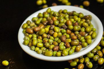 mung beans, mash. green beans in a white plate on the table. top food background. copy space