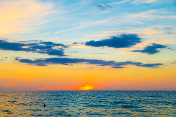 Colorful sunset sky on sea beach