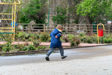 Small child running in a park