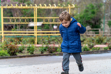 Small child running in a park