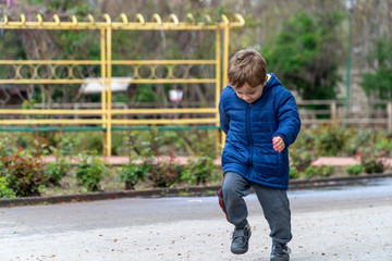 Small child running in a park