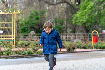 Small child running in a park