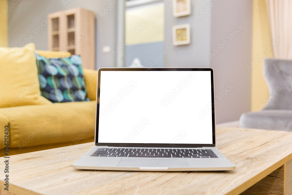 Wall mural laptop showing blank screen on work table front view in home- image