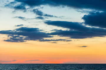 Naklejka na ściany i meble Colorful sunset sky on sea beach