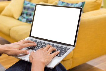 Fototapeta na wymiar Mockup image of a businessman using laptop with blank white desktop screen working in home- Image